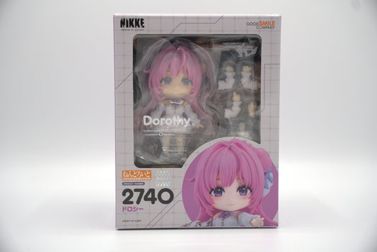 Nendoroid figure packaging with Dorothy from Goddess of Victory: NIKKE, a pink-haired character and visible branding on a white background
