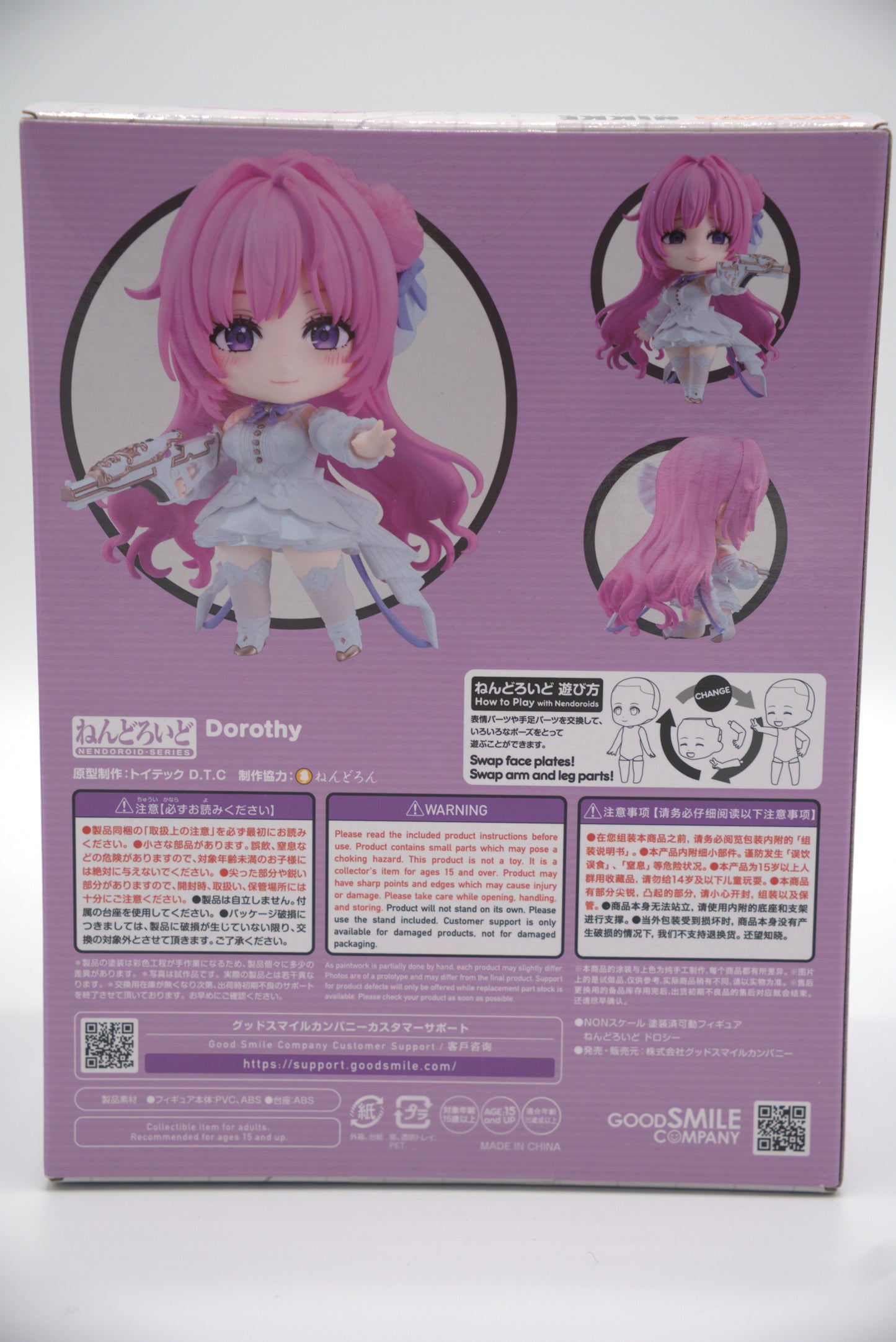 Nendoroid figure packaging with Dorothy from Goddess of Victory: NIKKE, a pink-haired character and visible branding on a white background