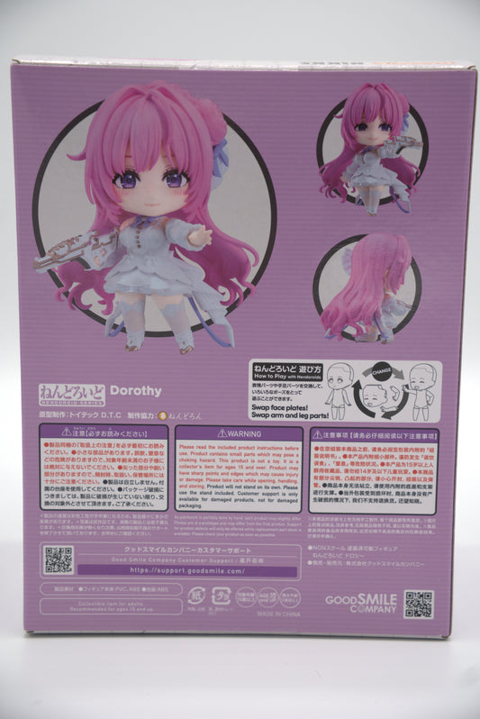 Nendoroid figure packaging with Dorothy from Goddess of Victory: NIKKE, a pink-haired character and visible branding on a white background