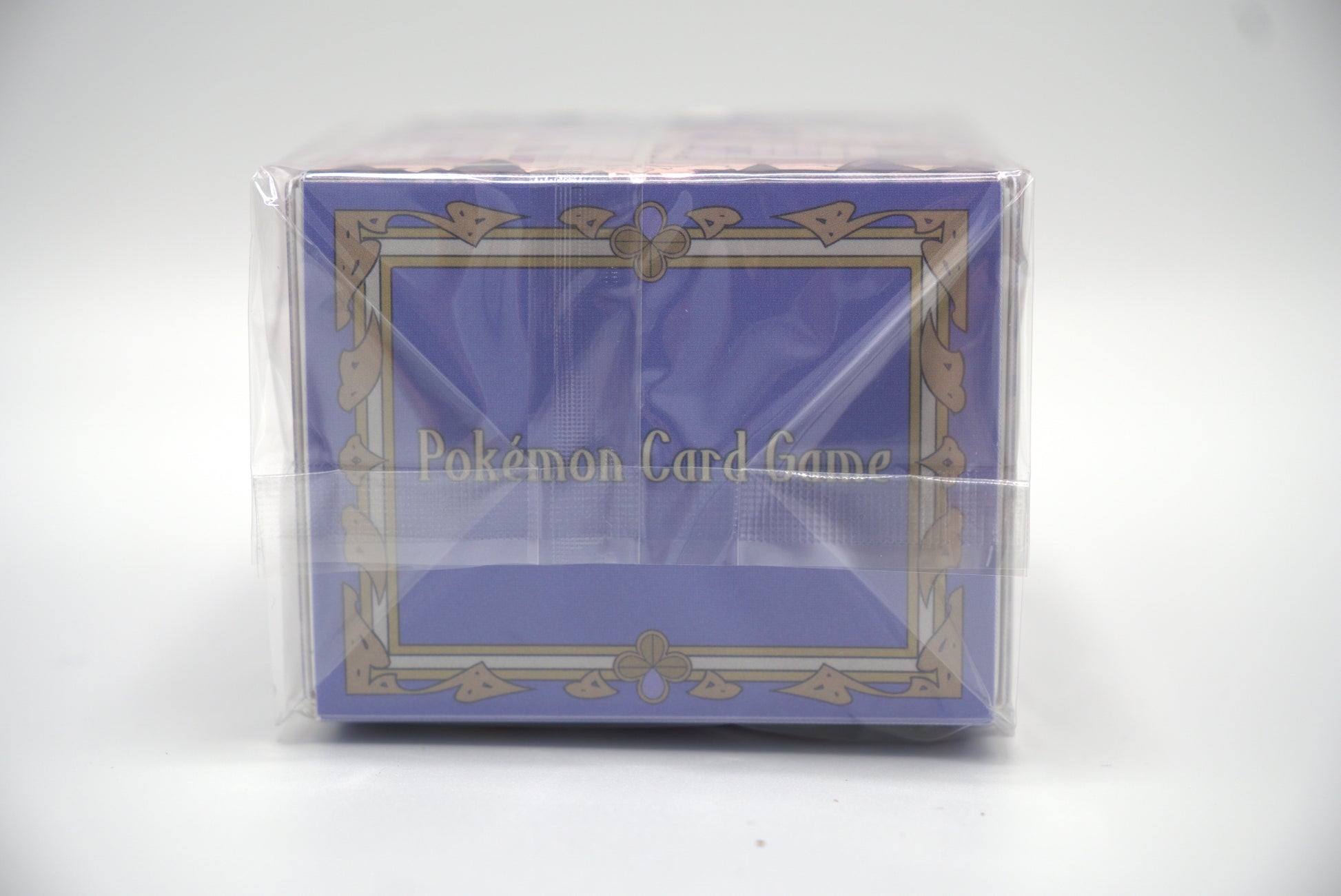 Pokémon Card Game packaging with a blue and gold design on a white background