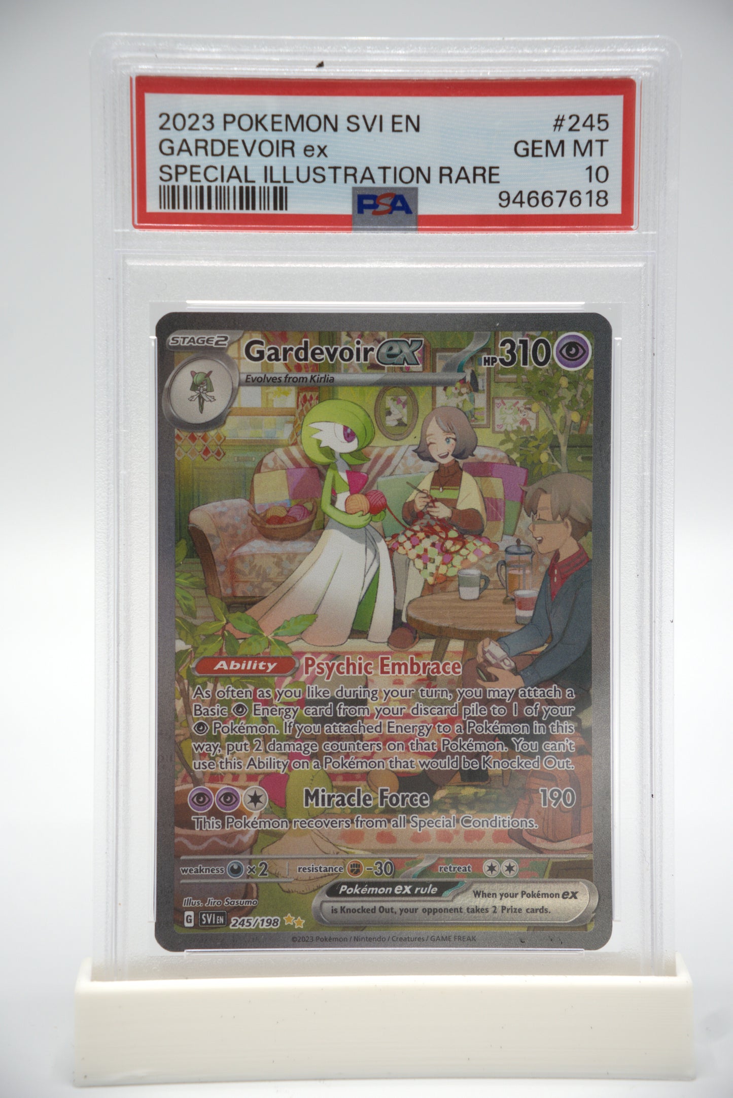 Pokémon trading card in a protective case on a white background
