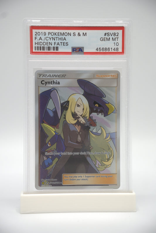 Trading card featuring a Cynthia with her pokemon, Garchomp, encased in protective plastic